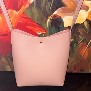 NWOT Elegant Blush Crossbody sleek Bag purse
8.5” x 7” x 3.5”